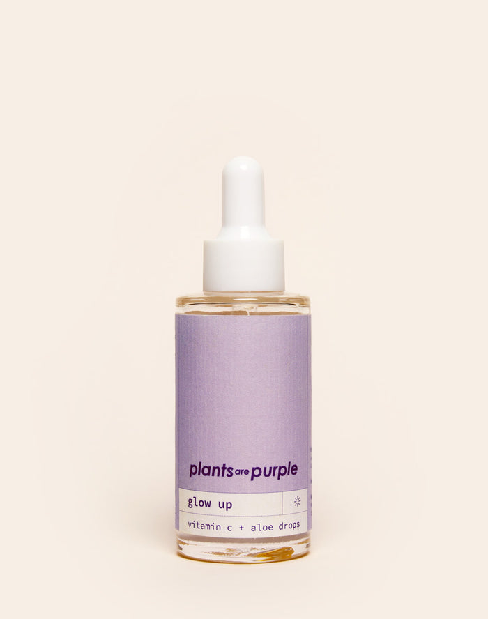 A bottle labeled 'plants are purple' with a dropper, containing vitamin C and aloe drops.