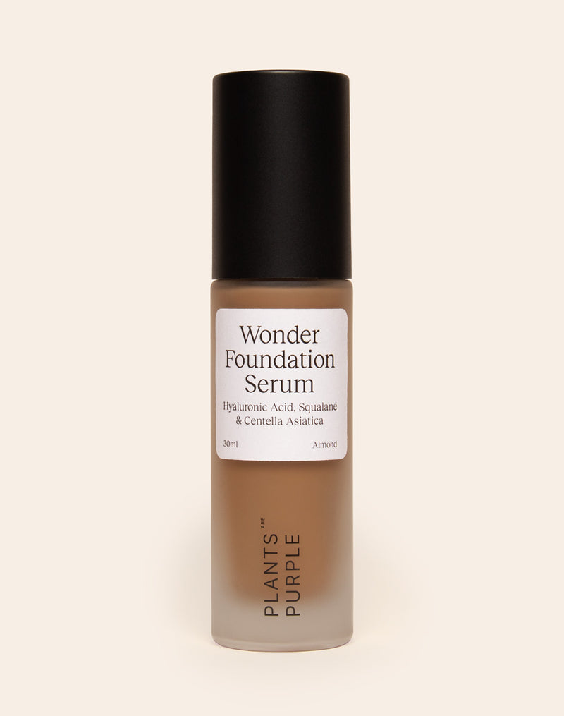 Bottle of Wonder Foundation Serum with a black cap.